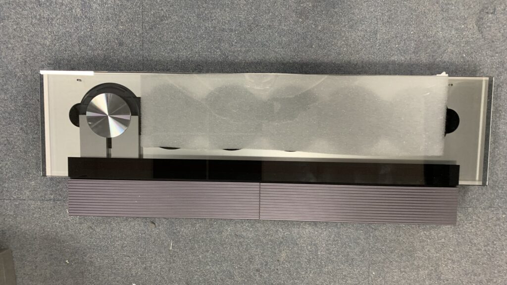 Place the thin piece of foam under the glass lid